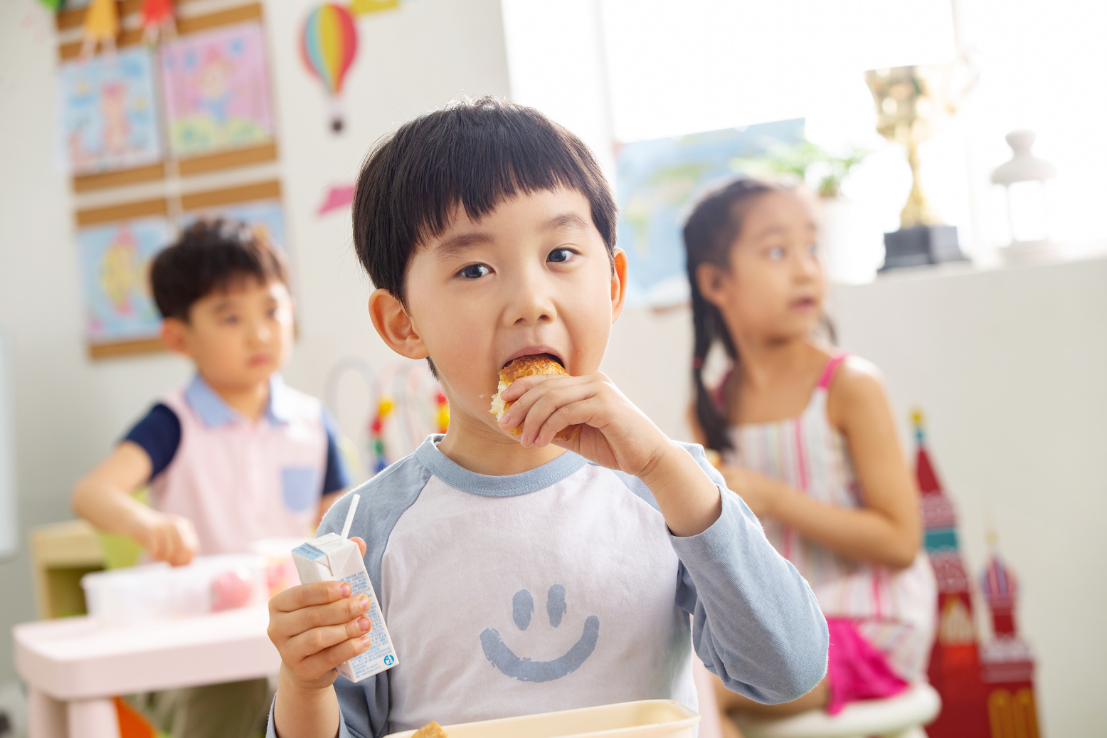 Kindergarten children eat